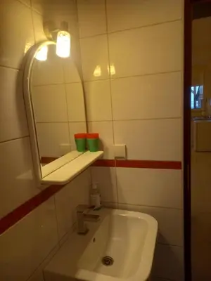 a bathroom with a sink and a mirror at Bungalo Đeković in Ulcinj