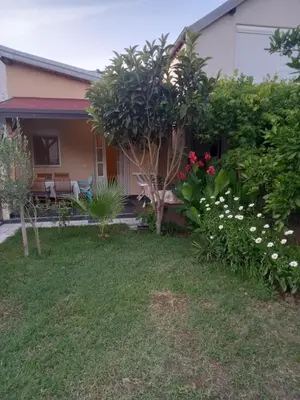 a garden in front of a house at Bungalo Đeković in Ulcinj