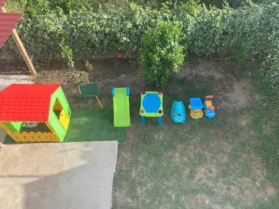 a group of toys sitting in the grass at Apartments Dibra in Ulcinj