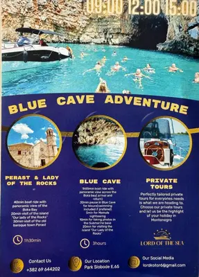 a blue cave adventure sign with people in the water at ENA Apartment in Kotor
