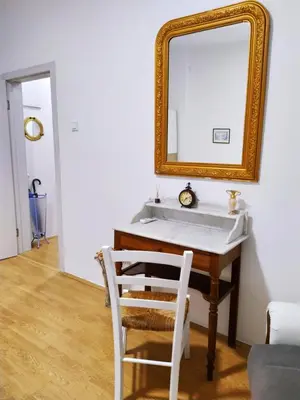 a bathroom with a white sink and a mirror at Podgorica Center in Podgorica