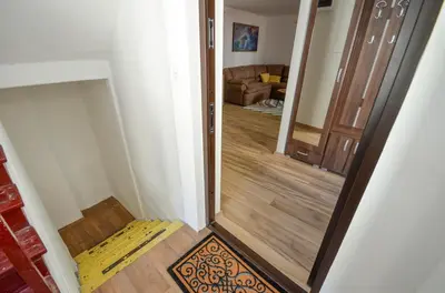 a hallway with a mirror and a door in a room at Portobello Old Town in Kotor
