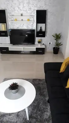 a living room with a couch and a coffee table at Apartmani Stijepovic in Podgorica