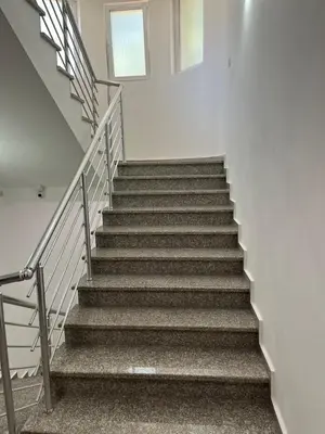 a stair case in a building with stairs at Villa Grand in Bar