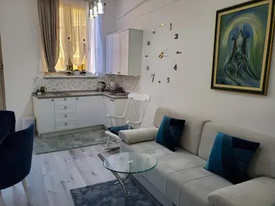 a living room with a couch and a table at MM Apartment in Budva