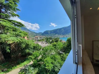 a view from a balcony of a city and the ocean at Viola lux apartments in Kotor