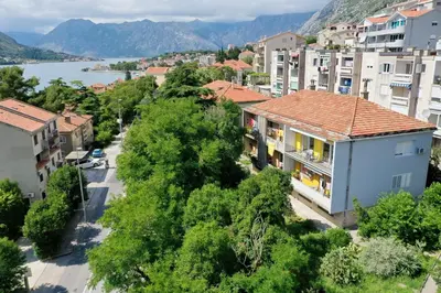 an aerial view of a town with a river and buildings at Viola lux apartments in Kotor