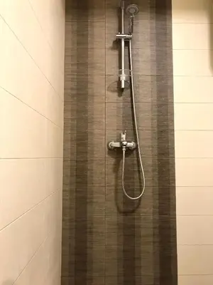 a shower with a shower head in a bathroom at New renovated Old Town Martiva Apartment in Kotor
