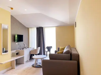 a living room with a couch and a table at Hotel Pierina in Budva