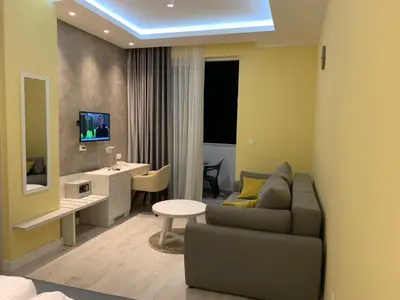 a living room with a couch and a table at Hotel Pierina in Budva
