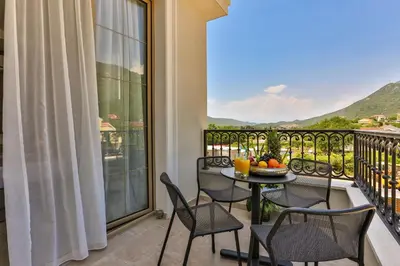 a balcony with a table and chairs and a view at Avanti Hotel & Spa in Budva