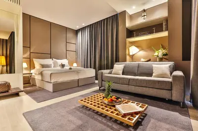 a living room with a bed and a couch at Avanti Hotel & Spa in Budva