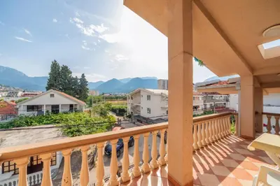 a balcony with a view of the mountains at Apartments Sara in Bar
