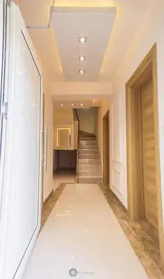 a hallway with stairs and a stair case at Basileus Apartments Budva in Budva