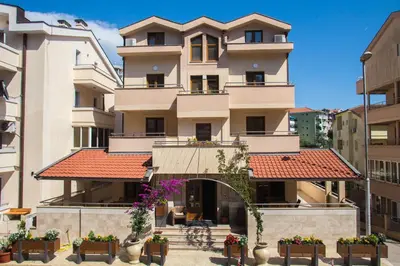 an apartment building with a red roof at Bel Mare Apartments in Budva