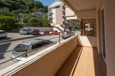 a balcony with cars parked on a street at Bel Mare Apartments in Budva