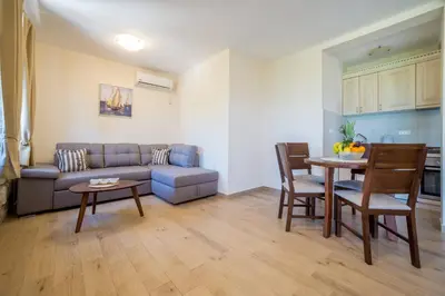 a living room with a couch and a table at Villa Old Castle Apartments in Kotor