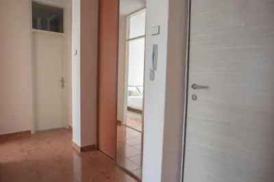 a glass door in a room with a hallway at Apartman Preko Morace 2018 in Podgorica