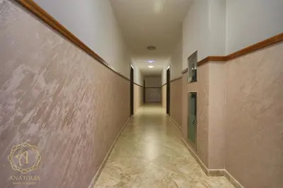 a long hallway with a corridorngth at Apartment Anatolia Pekovic in Becici
