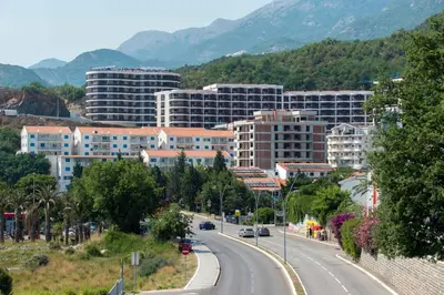 a city with buildings and a road in the foreground at Apartment Anatolia Pekovic in Becici