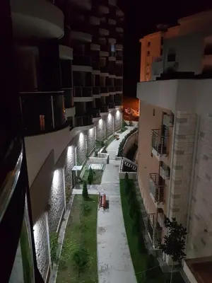 a view of a courtyard with lights in a building at Apartment Anatolia Pekovic in Becici