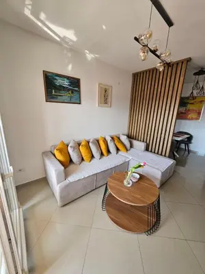 a living room with a couch and a table at Luda kuća in Bar
