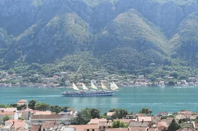 a large boat in a large body of water at Apartments Sea View in Kotor