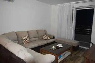 a living room with a couch and a coffee table at Apartments Sea View in Kotor
