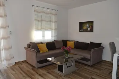 a living room with a couch and a coffee table at Apartments Sea View in Kotor