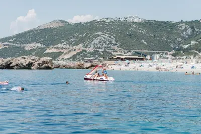 a group of people on a boat in the water at Sunset Hotel in Dobra Voda