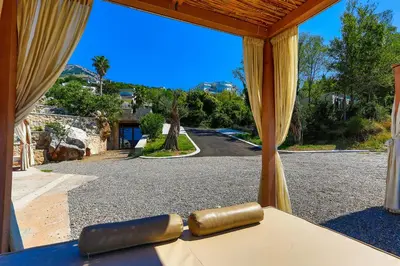 a view of a road from a room with curtains at Zelen LUX in Sutomore