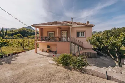 a small house with a balcony in a vineyard at Apartment Majstorina in Virpazar