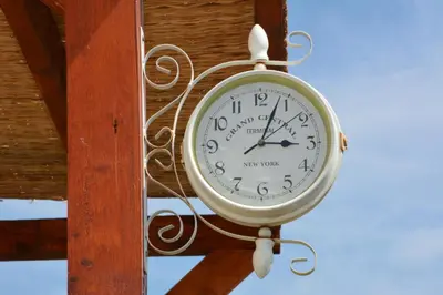 a clock hanging from the ceiling of a building at Vila Pelinovo in Kotor
