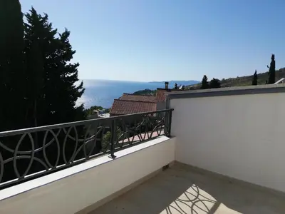 a balcony with a view of the ocean at Dolores Apartments in Petrovac na Moru