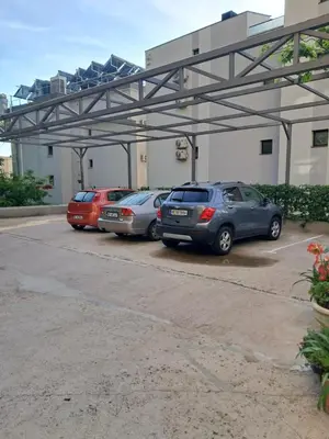 a group of cars parked in a parking lot at Apartman Verica in Rafailovici