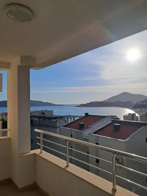 a balcony with a view of the water at Apartman Verica in Rafailovici