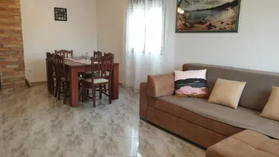 a living room with a couch and a table at Villa Katarina in Tivat