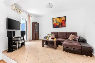 a living room with a couch and a tv at Antonella in Kotor