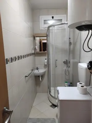 a bathroom with a shower and a sink at Stan u centru in Podgorica