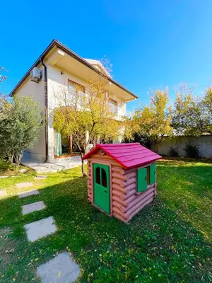 a small dog house in the yard of a house at Apartments Aerodrom in Podgorica