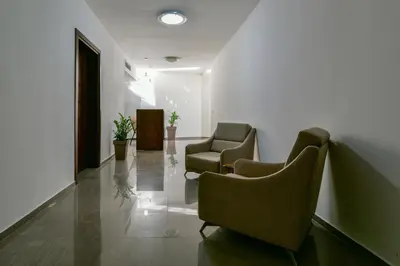 a waiting room with two chairs and a table at Apartmani Djurovic in Ulcinj