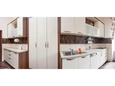 a kitchen with white cabinets and a sink at Apartment Palata Bizanti in Kotor