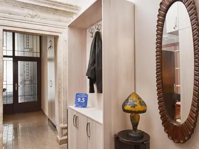 a mirror and a lamp in a hallway at Apartment Palata Bizanti in Kotor