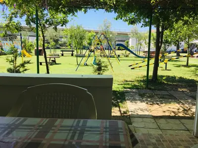 a view of a park with a playground at Flamingo Cottage in Ulcinj
