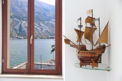 a glass window with a pirate ship on display at Luxury Waterfront Villa with Private Pool and Private Beach for 12 People in Kotor