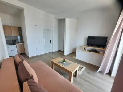 a living room with a couch and a table at Studio Apartments Jupo in Ulcinj