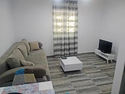 a living room with a couch and a tv at Take a Lake - Zabes, Virpazar in Virpazar