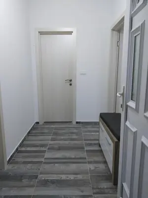 a hallway with a door and a tiled floor at Take a Lake - Zabes, Virpazar in Virpazar