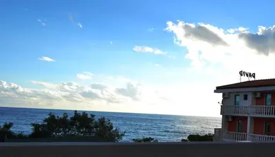 a building with a view of the ocean at Apartments Atlantis in Dobra Voda
