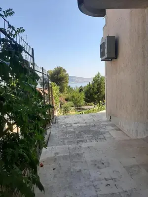 a stone walkway leading up to a building at Бар Шушань Апартаменты Главановича 25 in Bar
